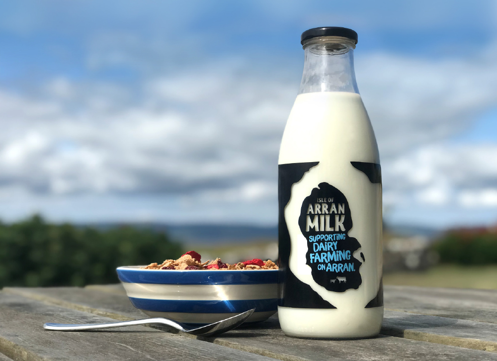 Arran Milk bottle next to a bowl of cereal